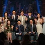 Global drama stars on a vibrant US talk show set, engaging with the host and audience.