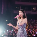 IU performing live on stage in 2026