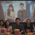 Friends enjoying a C-drama together on a large screen with subtitles